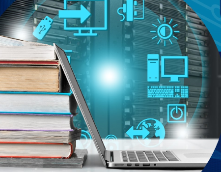 Computador portátil apoyado sobre una pila de libros